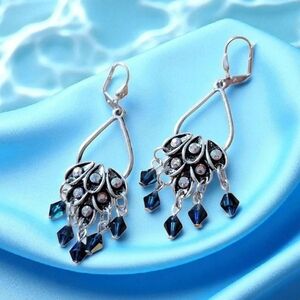 Navy blue peacock feather shape earrings in silver tone